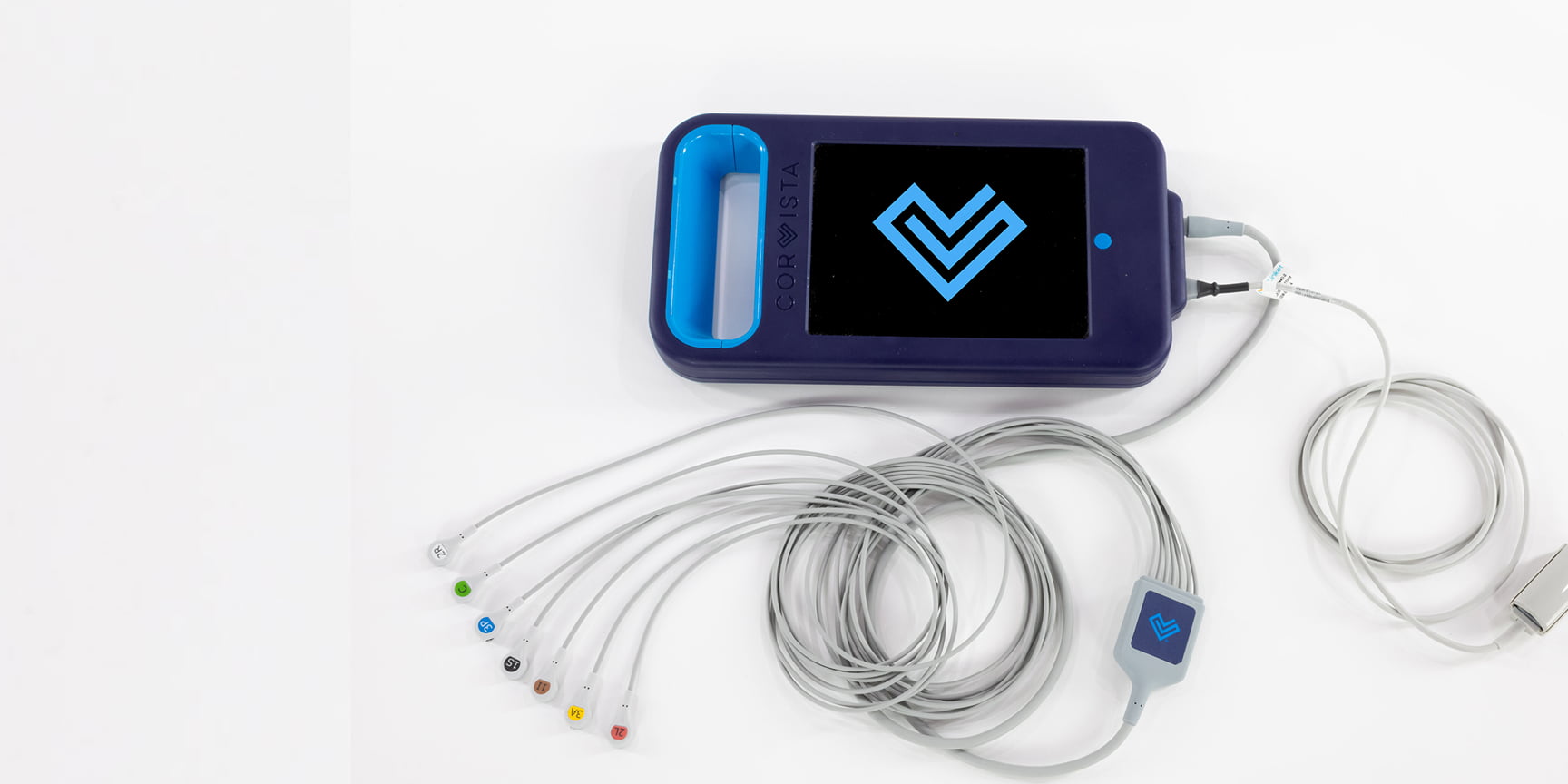 A device with a CorVista logo on the screen, with wires attached.